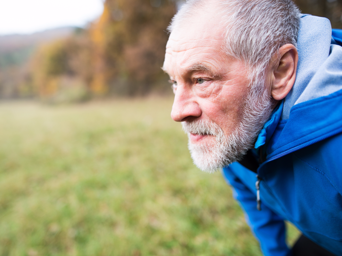 older man elderly man jogging nature running exercise thinking outdoors