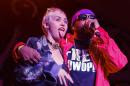 Miley Cyrus, left, joins Mike Will Made It onstage at the Fader Fort Presented by Converse during the SXSW Music Festival on Thursday, March 19, 2015 in Austin, Texas. (Photo by Jack Plunkett/Invision/AP)