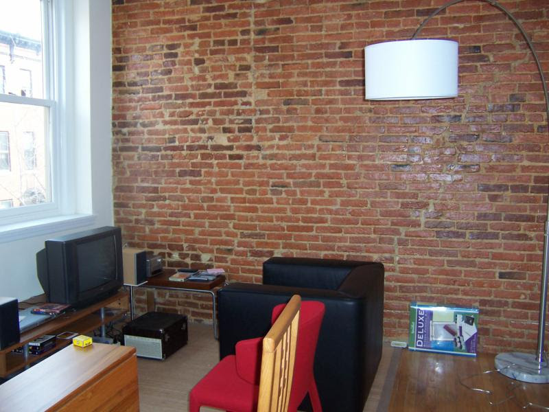 The exposed brick wall,