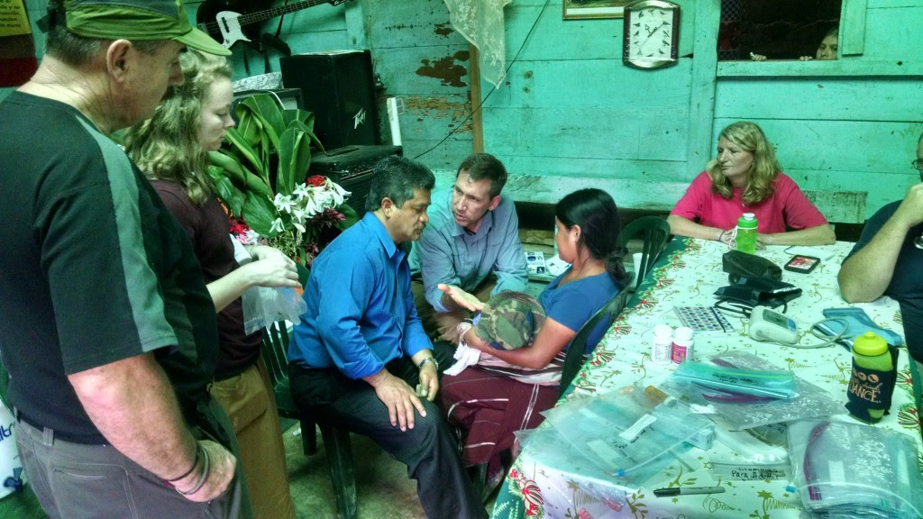 Discussing care of a very sick baby with his mother