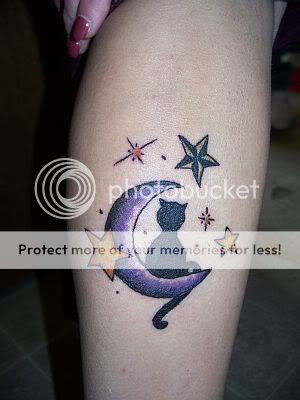 Cat tattoo with moon and stars