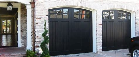 Garage door service repair tech needed asap! Love the black garage doors - Cityscape Garage Doors