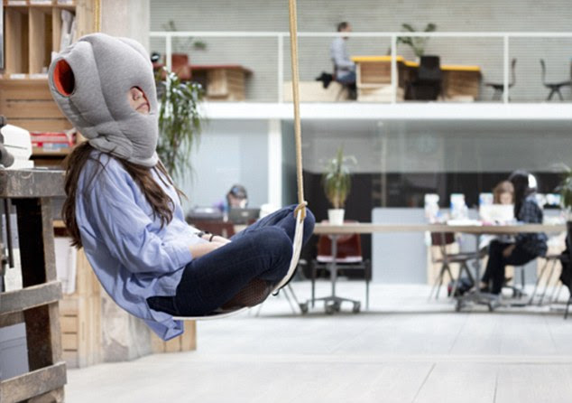Nap on the go: The Ostrich Pillow, £63 can be used on the plane, train or even in the office 