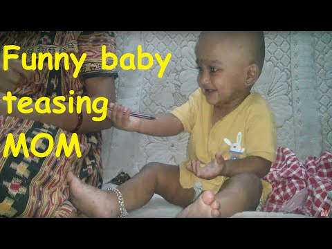 Funny baby teasing mom