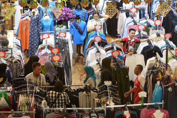 Getting ready: A wide variety of clothes and goods at Kenanga Wholesale City draw shoppers who are doing their last-minute shopping for Hari Raya Aidilfitri. â ONG SOON HIN/The Star