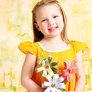 girl holding paper flowers