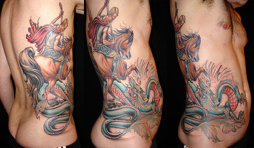  a guys rib cage. The tattoo was created by tattoo artist, W. T Norbert.