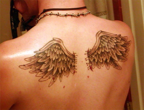 Angel Wing Tattoos. Some angel wing tattoos are small designs.