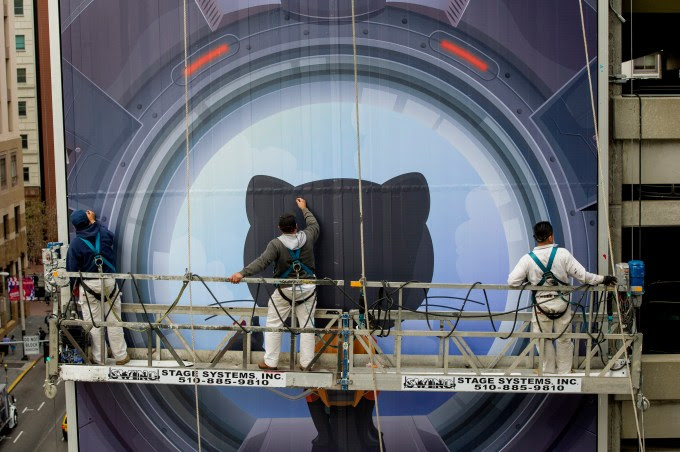 Workers install a billboard for GitHub Inc. in San Francisco, California, U.S., on Tuesday, Nov. 11, 2014. GitHub, which provides open-source code hosting services and has raised more than $100 million from investors, is among tech startups boosting demand for billboard space around Silicon Valley. Photographer: David Paul Morris/Bloomberg via Getty Images