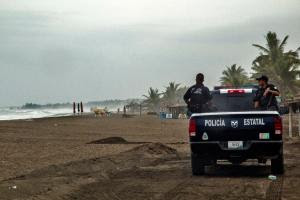 Police patrol the beach in Boca de Pascuales, Colima …