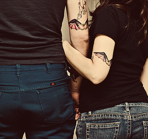  that's right. matching bat-gina tattoos.