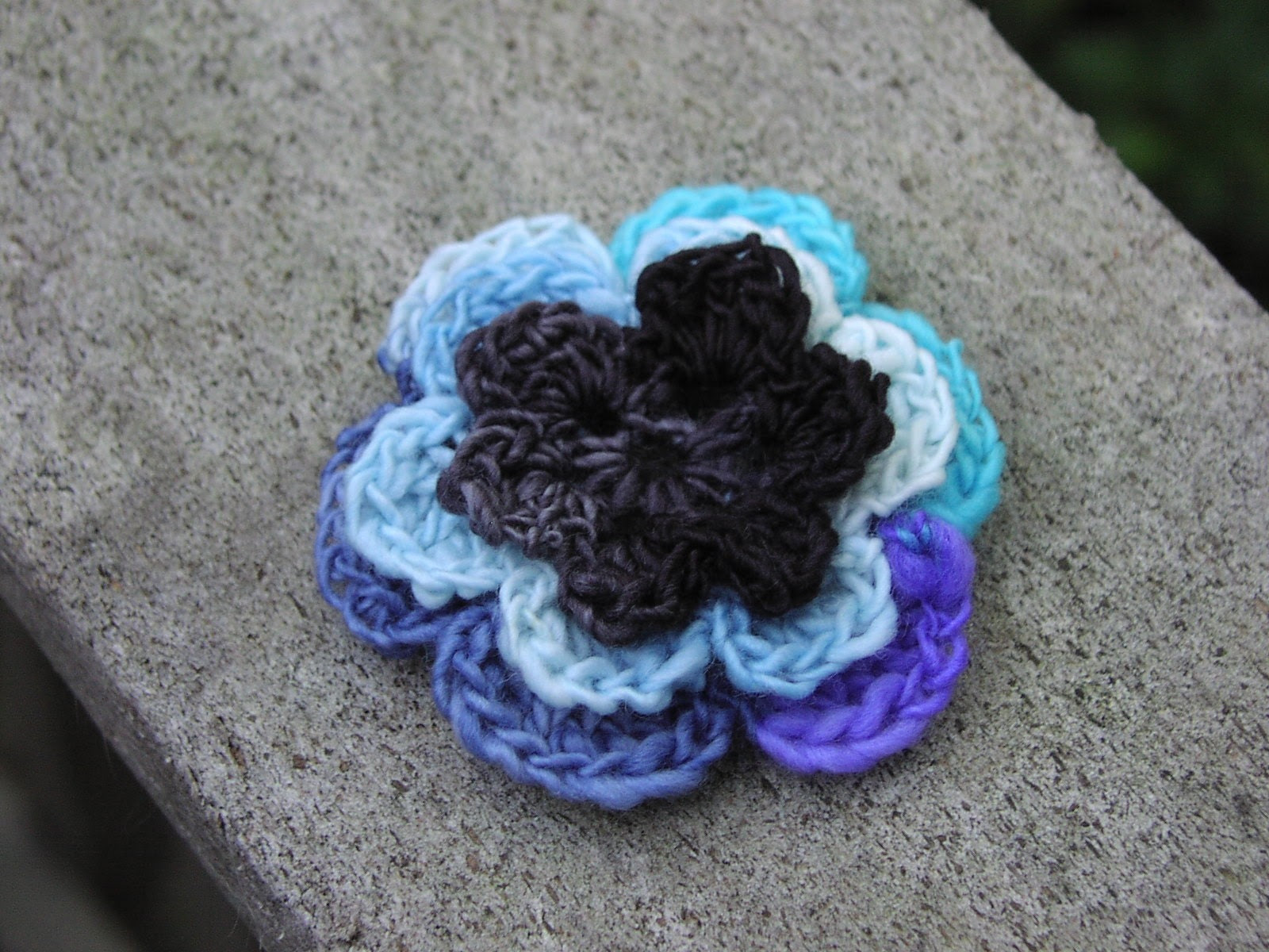 Bruise, crocheted wool flower brooch, black blue and purple, ONLY ONE