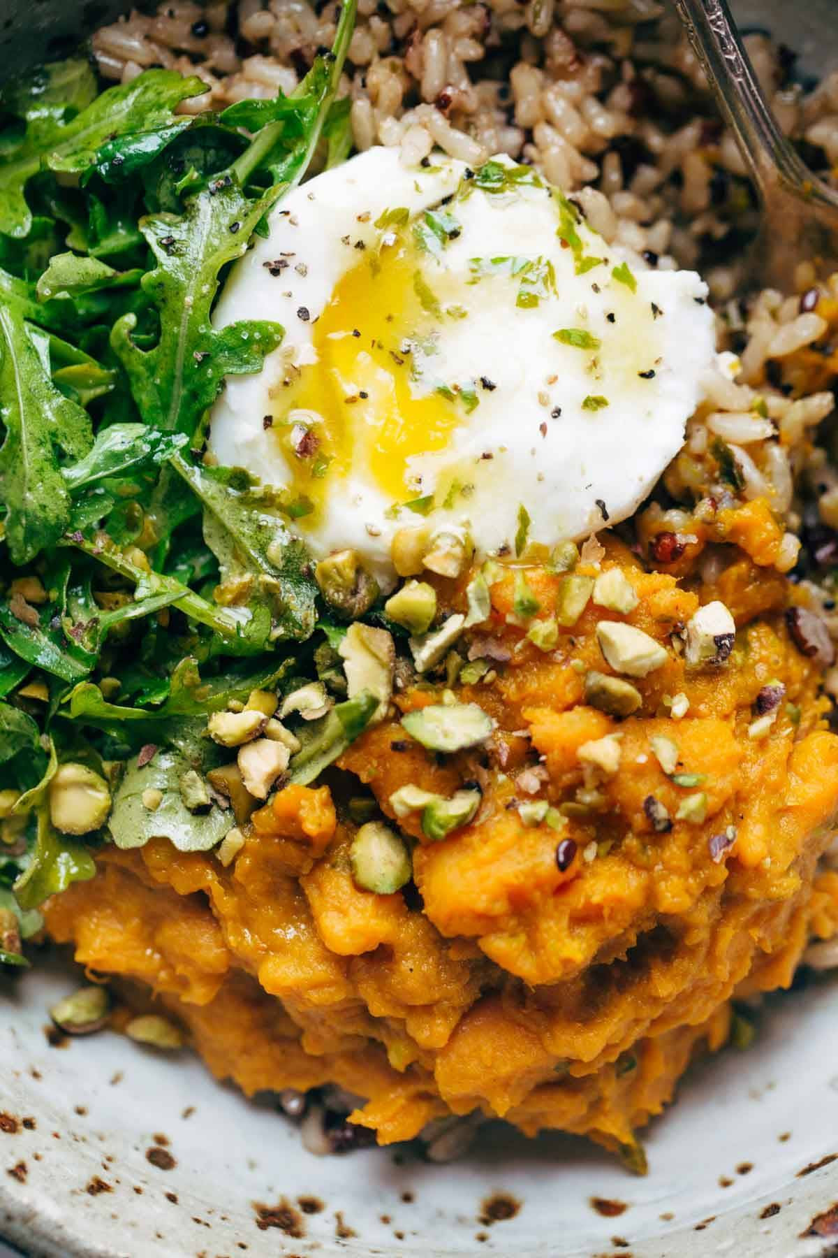Healing Bowls: turmeric sweet potatoes, brown rice, red quinoa, arugula, poached egg, lemon dressing. | pinchofyum.com