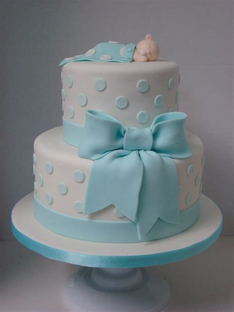 Line bottoms with waxed paper and spray again. Its a boy | 2 tier cake with baby blue polka dots and bow