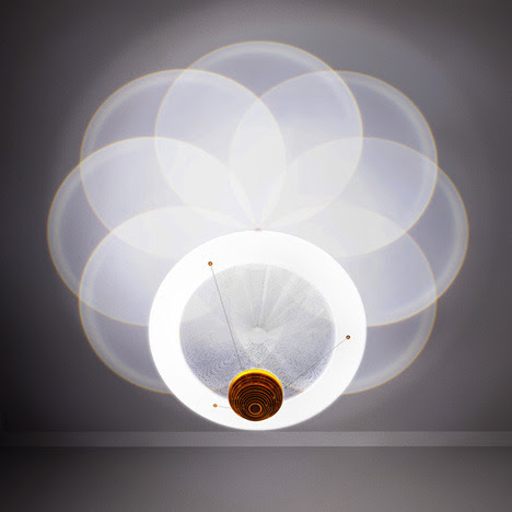 Chandelier by Troika. Large fresnel lenses shape light from LEDs suspended below into overlapping geometric patterns on the ceiling of the Royal Society of Arts‘ headquarters in London.