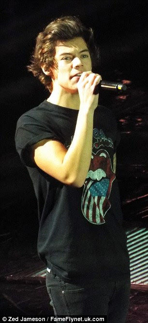 Favourite band? Heartthrob singer Harry shows his love of The Rolling Stones as he wears a T-shirt with the band's name on the front