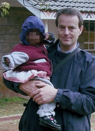 With a child at the Nyumbani Children's Home for kids infected with HIV. No one complained about his behaviour there