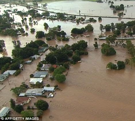 Rooftop rescues: Floods in the town of Biloela in the Australian state of Queenland. Helicopters plucked dozens of stranded Australians to safety today