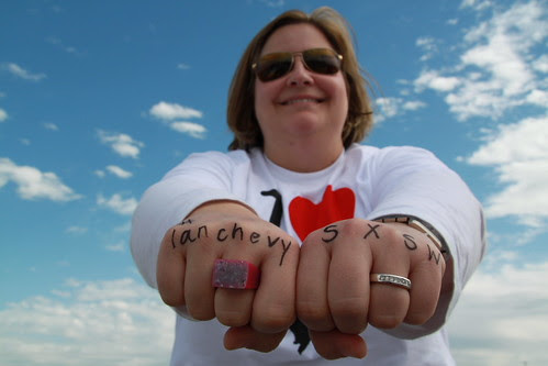 Betsy Weber gets the classic tattoo across her knuckles.