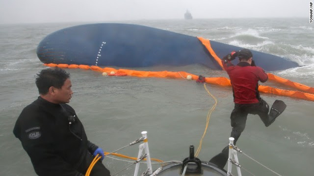 Rescue personnel dive April 17 during search operations.