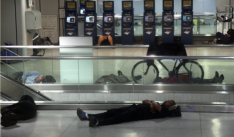 Hurricane Irene: People sleep at Penn Station in New York