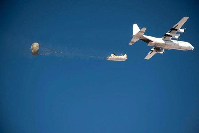 A test article containing the Orion spacecraft's 3 parachutes is deployed from a C-130 aircraft above Arizona's Yuma Proving Grounds last week.