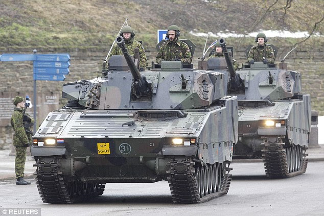 The display was held amid heightened tensions between Nato and Russia over Ukraine. Pictured are soldiers from the Netherlands in light tanks