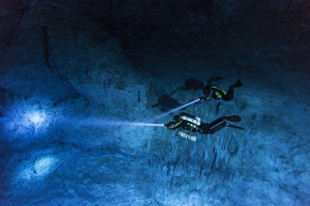Divers Susan Bird and Alberto Nava search the walls of Hoyo Negro, an underwater cave on Mexico¿s Yucatán Peninsula where the remains of Naia were found.