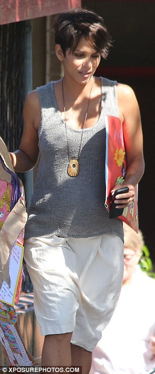 You can just see it! Though her shirt was loose-fitted, it was tight enough to reveal a glimpse of Halle's baby-to-be