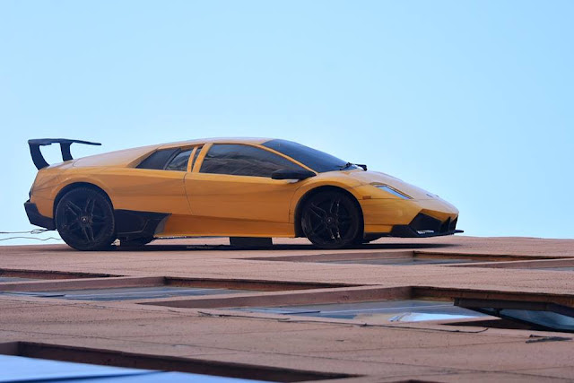 ‘Luxury car’ races up building, entertainment news