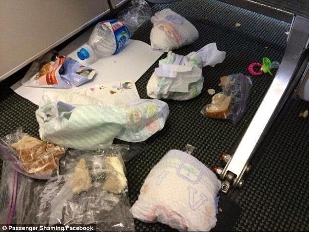 Some parents opt to change their baby's dirty diaper on the seat beside them or the tray table in front 
