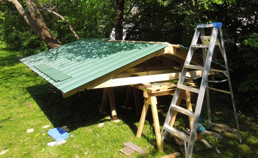 Final sheets installed, now working on installing the ridge cap. It's ...