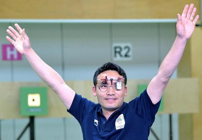 Jitu Rai celebrates after winning a gold medal in the men's 10m air pistol shooting event on day five of the 2018 Commonwealth Games.