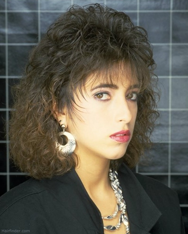 Hairstyle with short spiffy layers and volume upon the head
