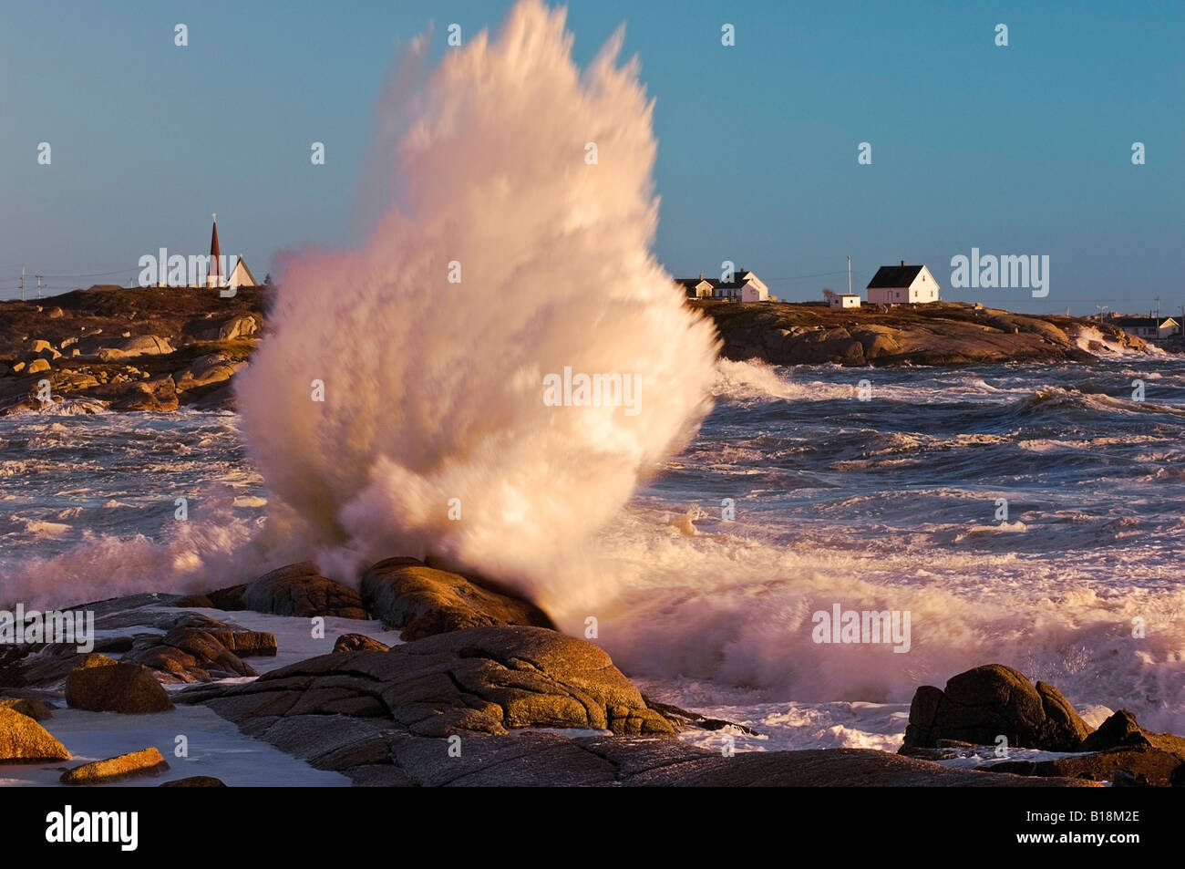 Storm waves crashing into granite coastline