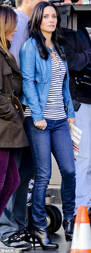 Looking lost: Courteney's character, who lives in Florida, looked lost carrying a map of Hollywood