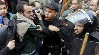 Journalist being challenged by Egyptian Police