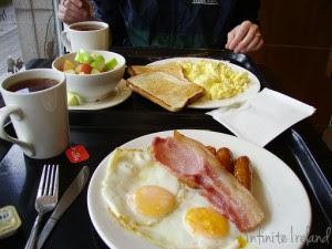 Bacon, Sausage, eggs, toast, tea, & fruit