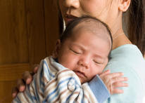 Sick baby with caring mom