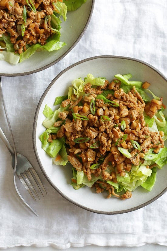 Rather than serving these Asian Chicken Lettuce Wraps as an appetizer, everything is served over a great big chopped salad! Light, quick and easy to make!