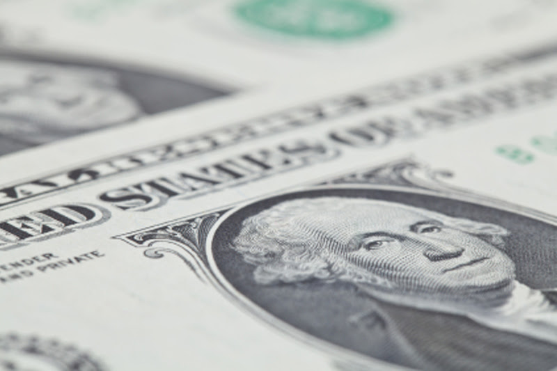 Dollar little changed vs. rivals in quiet trade