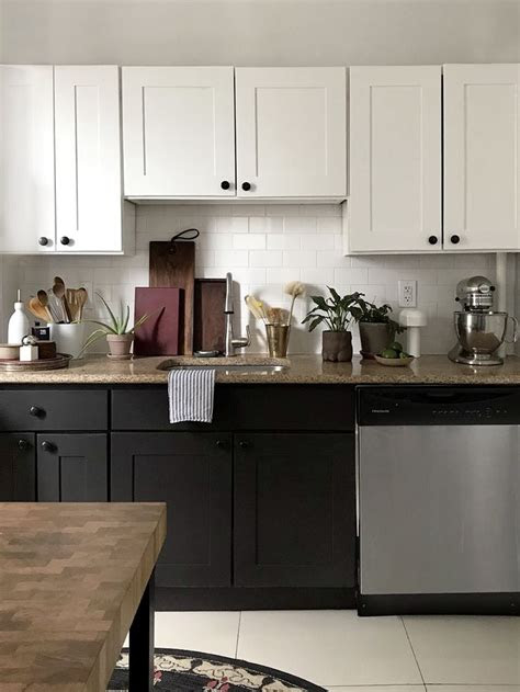 The upper cabinets are painted matte white. How to Paint Wooden Kitchen Cabinets Step-by-Step in 2020