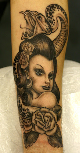 Pin up and Snake Tattoo by The Tattoo Studio