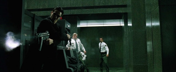 Neo firing his MP5Ks.