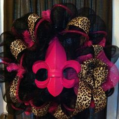 Wild cheetah & hot pink deco mesh wreath with a metal fleur de lis!  Made by wild child designs on facebook! $45    Would <3 this for her room