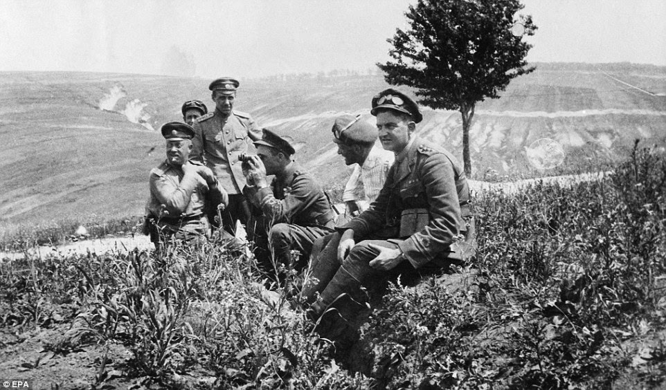 epa04298308 A handout picture provided by the Multimedia Art Museum, Moscow (MAMM) press service in Moscow, Russia on 04 July 2014 shows an old photograph entitled 'British and Russian officers of the RNAS Armoured Car Squadron in Galicia prior to the Russian offensive of July 1917' by an unknown identity, from a collection of the Imperial War Museums in London, Britain. MAMM is presenting multimedia project 'The War That Ended Peace' organized together with major international museums, state archives and private collectors of Russia, France and Italy to mark the 100th anniversary of the First World War. The exhibition runs from 04 July to 19 October 2014.  EPA/IMPERIAL WAR MUSEUMS / HANDOUT EDITORIAL USE ONLY IN CONNECTION TO THE REPORTING ON THE STORY HANDOUT EDITORIAL USE ONLY/NO SALES