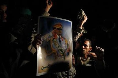 Libyans supporting the government against the imperialist airstrikes in a mass demonstration on March 20, 2011. In Greece the Communist Party youth wing has protested the attacks and the Greek government's role in the genocidal attacks. by Pan-African News Wire File Photos