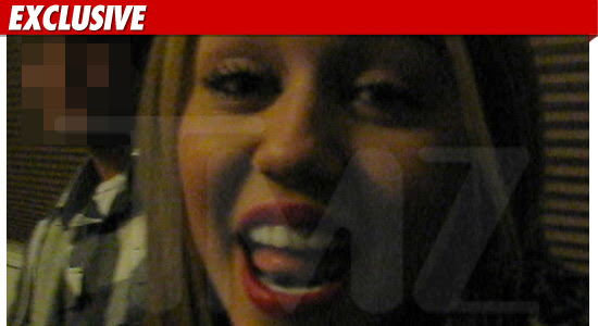 picture of miley cyrus smoking a bong. miley cyrus smoking bong pics.