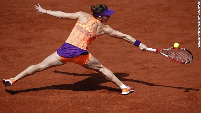 Halep, the world No.4, is stretched by Sharapova's big serves and powerful play but she hangs tough in a seesawing second set.