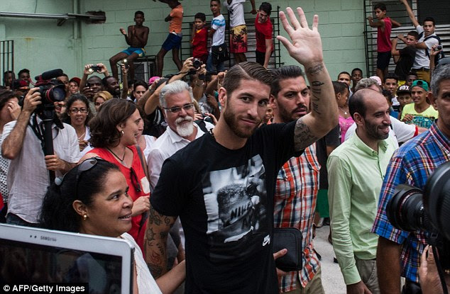 Ramos (centre) is said to be unhappy at being undervalued by Madrid during contract negotiations